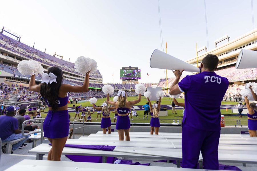 Cheerleaders cheer from the stands in the Kansas State football game. (Heesoo Yang/Staff Photographer)
