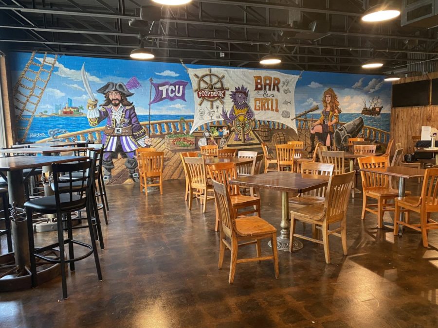 This photo shows half the inside dining area of the new Poop Deck location, which is adorned with various TCU decorations. (Caroline Fisher/ Reporter)