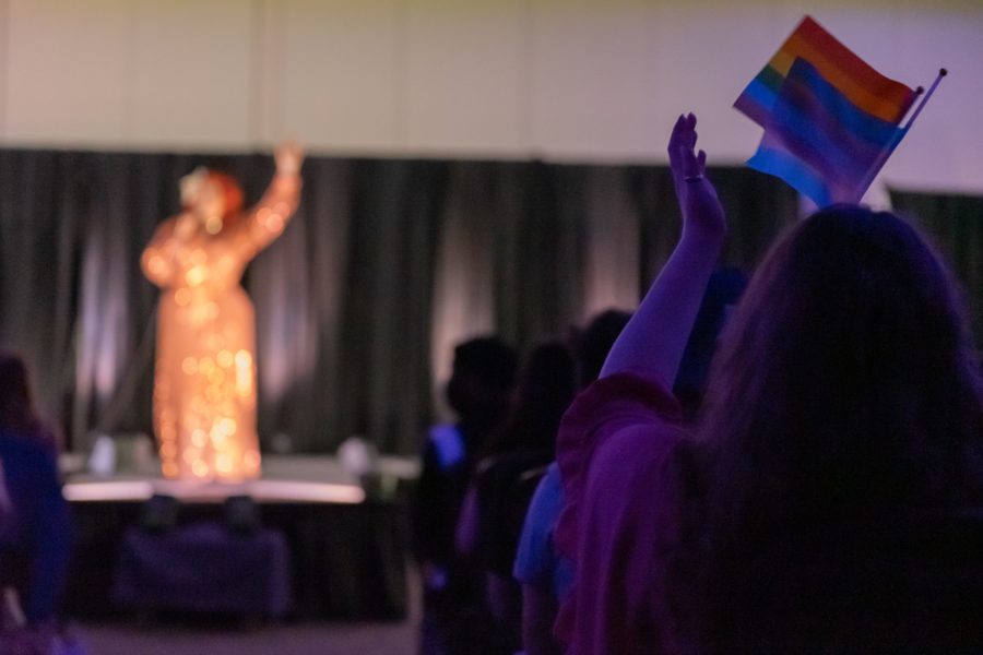 A rainbow flag is held in the crowd during the drag show event (JD Pells/Staff Photographer) 