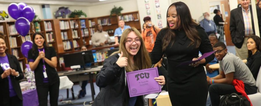 A student celebrates receiving a scholarship to TCU.