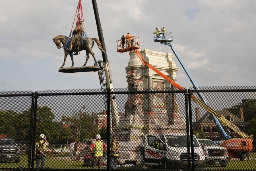 Crews remove one of the countrys largest remaining monuments to the Confederacy, a towering statue of Confederate General Robert E. Lee on Monument Avenue in Richmond, Va., Wednesday, Sept. 8, 2021. (AP Photo/Steve Helber)