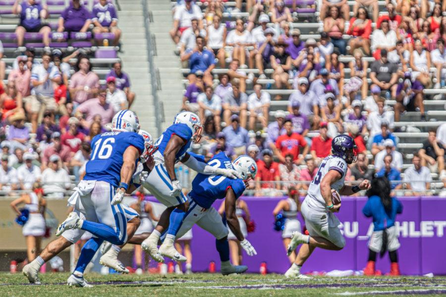 TCU quarterback Max Duggan (15) runs for his life from a group of SMU defenders in the Battle for the Iron Skillet on Sept. 25, 2021. (Esau Rodriguez/Staff Photographer)