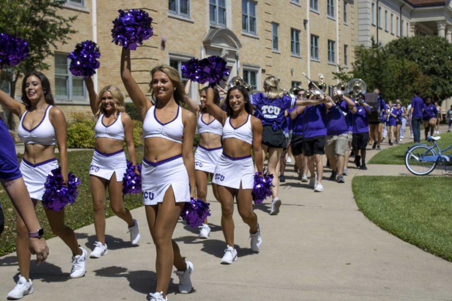 TCU Showgirls, Horned Frog Marching Band, and Dutchmen parade through campus. Photo by Allie Brown