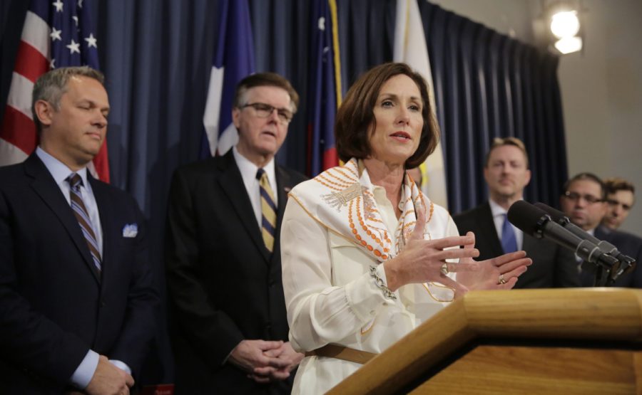 FILE - In this file photo from March 6, 2017, Texas Sen. Lois Kolkhorst, front, backed by Texas Lt. Gov. Dan Patrick, center, and other legislators talk to the media during a news conference to discuss Senate Bill 6 at the Texas Capitol in Austin, Texas. Just months after a high-profile study revealed that Texas has one of the highest maternal mortality rates in the developed world, state lawmakers failed to respond by passing comprehensive legislation to combat the crisis during the legislative session. (AP Photo/Eric Gay, File)
