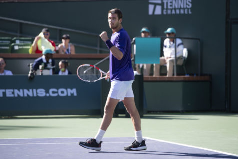 Cameron Norrie, of Britain, pumps his first after winning a semifinal match Saturday, Oct. 16, 2021, in Indian Wells, Calif. (AP Photo/John McCoy)