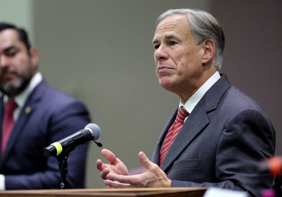 FILE - In this Sept. 22, 2021, file photo, Texas Gov. Greg Abbott speaks before he signs an anti-smuggling bill at McAllen City Hall in McAllen, Texas. Gov. Abbott has signed redrawn voting maps that pave a safer path for the GOP's slipping majority, leaving opponents hoping courts will block the newly gerrymandered districts before they can be used in the 2022 elections. Abbott signed the maps Monday, Oct. 25, 2021, according to a spokeswoman for the governor. (Joel Marinez/The Monitor via AP, File)