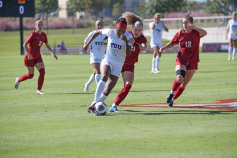 Senior forward Messiah Bright dribbles past defenders in the quarterfinal matchup of the Big 12 Championship against Iowa State in the Round Rock Multipurpose Complex on Oct. 31, 2021. (Photo courtesy of: @TCUSoccer)
