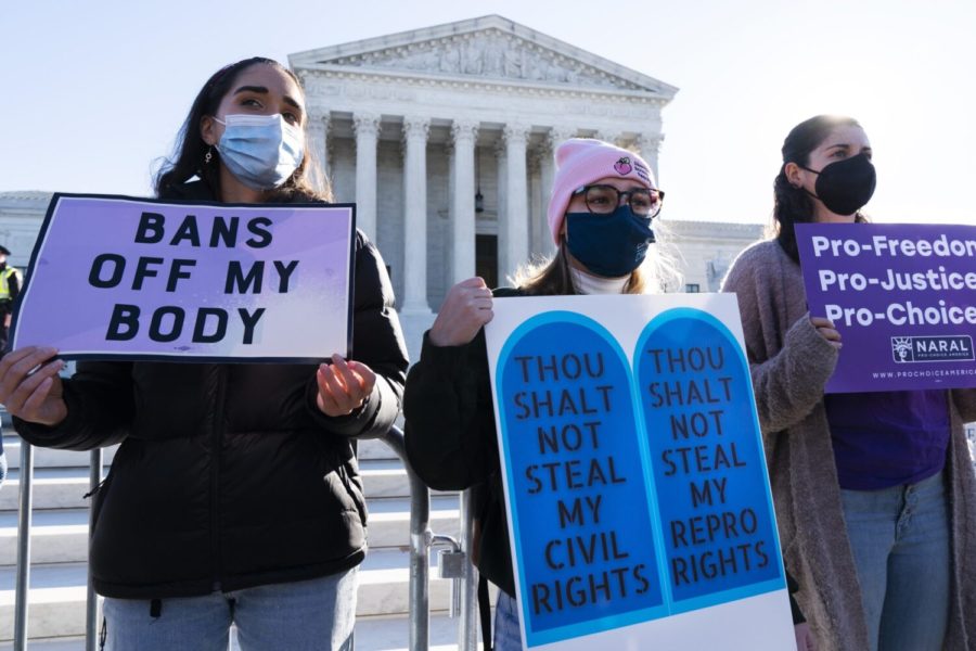 People join a abortion-rights rally outside the Supreme Court, Monday, Nov. 1, 2021, as arguments are set to begin about abortion by the court. (AP Photo/Jacquelyn Martin)