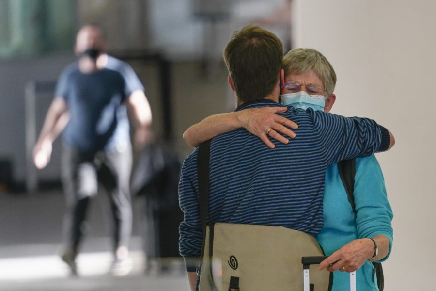 Reunited after two years: Til Wagenaar greets her son, Joost Wagenaar, after she flew from the Netherlands at Newark Liberty International Airport in Newark, N.J., Monday, Nov. 8, 2021. (AP Photo/Seth Wenig)