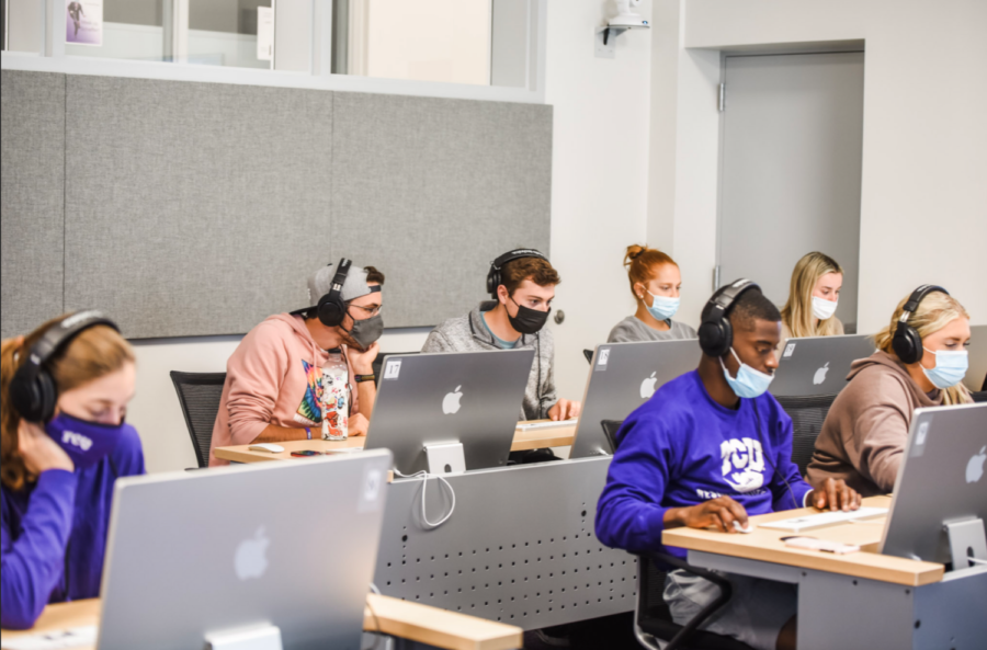 Students in class work on finishing their podcasts in the new Moudy South media lab. (Photo courtesy of Charity Robinson)