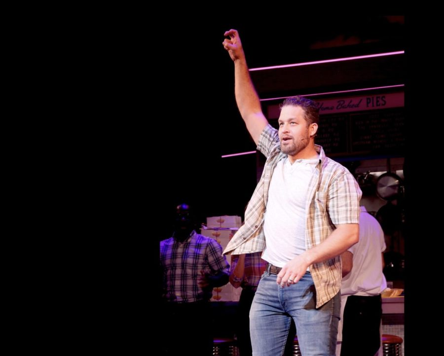 Ben Thompson throws the Horned Frog hand sign during bows at reopening night of Waitress on Broadway. (Photo by Bruce Glikas, courtesy of Ben Thompson)