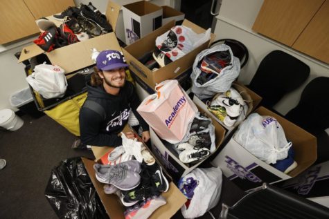 Luke Savage, a pitcher for the TCU baseball team, poses next to a stack of gear donated to Blessed Feet. (Photo courtesy of Luke Savage)