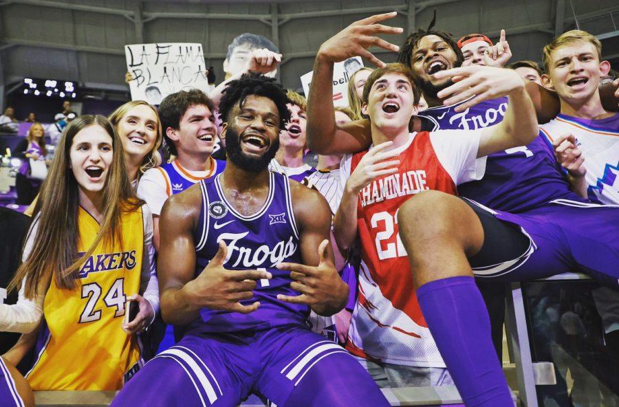 TCUs Mike Miles (1) and Eddie Lamkin (4) celebrate with the student section after a 71-63 win over Oral Roberts on Dec. 2, 2021. (Photo courtesy of gofrogs.com)