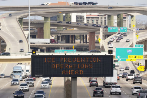 A street sign warns drivers of ice prevention operations on highways ahead of winter weather in Dallas, Tuesday, Feb. 1, 2022. A major winter storm was expected to affect a huge swath of the United States, with heavy snow starting in the Rockies and freezing rain as far south as Texas before it drops snow and ice on the Midwest. The forecast comes nearly a year after a catastrophic winter storm devastated Texas power grid, causing hundreds of deaths. (AP Photo/LM Otero)