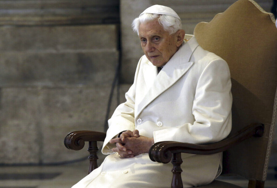 Pope Emeritus Benedict XVI sits in St. Peters Basilica as he attends the ceremony marking the start of the Holy Year, at the Vatican, Tuesday, Dec. 8, 2015. Pope Francis declared Tuesday that mercy trumps moralizing in the Catholic Church, as he opened a special Holy Year marked by unprecedented security aimed at thwarting a Paris-style attack at the Vatican. (AP Photo/Gregorio Borgia)