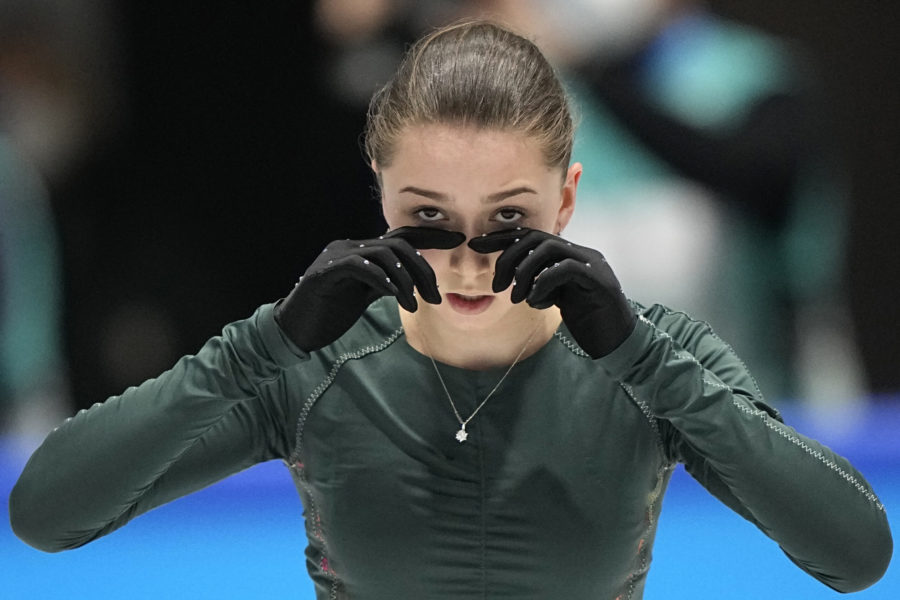 Kamila Valieva, of the Russian Olympic Committee, wipes her eyes during a training session at the 2022 Winter Olympics, Sunday, Feb. 13, 2022, in Beijing. (AP Photo/David J. Phillip)