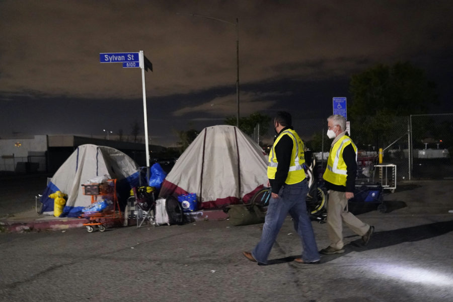 FILE+-+Los+Angeles+city+councilmember+Paul+Krekorian%2C+right%2C+walks+past+tents+where+people+are+living+as+he+walks+with+staff+member+Karo+Torossian+during+an+official+homeless+count+on+Feb.+22%2C+2022%2C+in+the+North+Hollywood+section+of+Los+Angeles.+Californias+governor+proposed+a+plan+on+Thursday%2C+March+3%2C+2022%2C+to+force+homeless+people+with+severe+mental+health+and+addiction+disorders+into+treatment.+++%28AP+Photo%2FMarcio+Jose+Sanchez%2C+File%29
