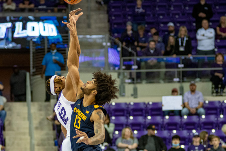 TCU center Xavier Cork (12) goes up for the tip off in TCU's 77-67 win over West Virginia in Fort Worth, Texas, on Feb. 21, 2022. (Esau Rodriguez Olvera/Head Staff Photographer)