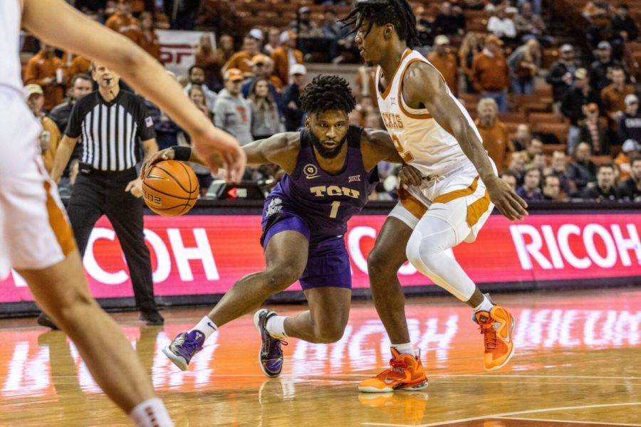 TCU guard Mike Miles dribbles while defended in TCU's loss to No. 20 Texas on Feb. 23, 2022, in Austin, Texas. (Photo courtesy of gofrogs.com)