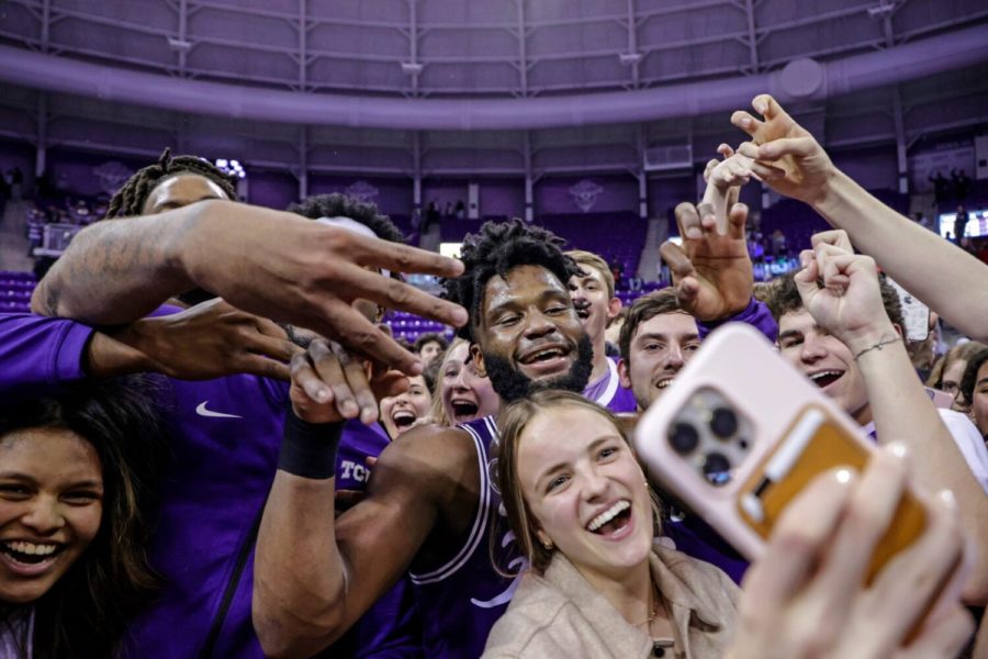 TCU guard Mike Miles (center) celebrates with fans following TCU’s 69-66 upset of No. 9 Texas Tech in Fort Worth, Texas, on Feb. 26, 2022. (Photo courtesy of gofrogs.com)