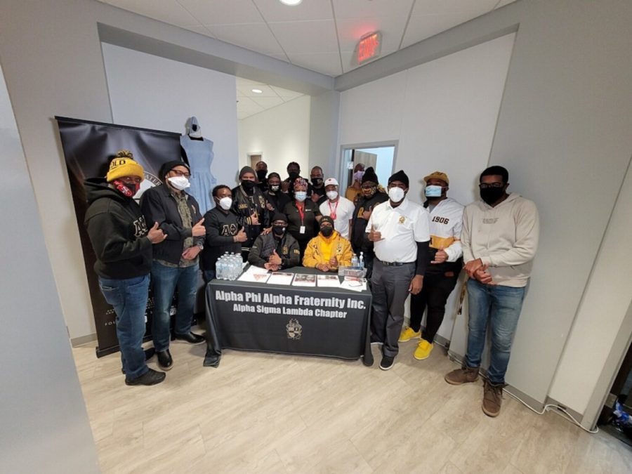 Alpha Phi Alpha fraternity and Rena Witherspoon (center) spreading awareness and educating those about sickle cell. (Courtesy of Zach Rouseau)