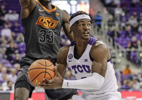 TCU forward Emanuel Miller is guarded closely in the paint against Oklahoma State at Schollmaier Arena in Fort Worth, Texas, on Feb. 8, 2022. (Photo courtesy of gofrogs.com)