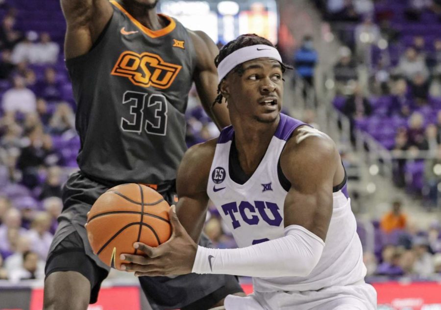 TCU+forward+Emanuel+Miller+is+guarded+closely+in+the+paint+against+Oklahoma+State+at+Schollmaier+Arena+in+Fort+Worth%2C+Texas%2C+on+Feb.+8%2C+2022.+%28Photo+courtesy+of+gofrogs.com%29