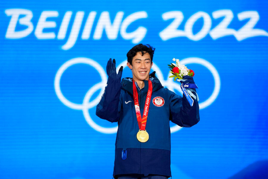 Gold medalist Nathan Chen of the United States celebrates during the medal ceremony for the men's free skate figure skating at the 2022 Winter Olympics, Thursday, Feb. 10, 2022, in Beijing. (AP Photo/Jae C. Hong)