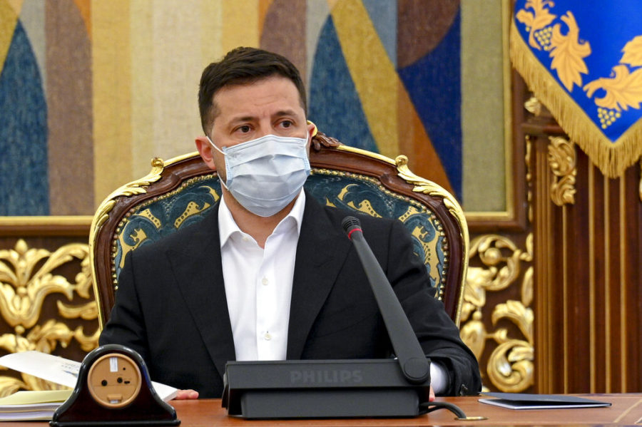In this photo released by Ukrainian Presidential Press Office, Ukrainian President Volodymyr Zelenskyy leads a meeting of the National Security and Defense Council in Kyiv, Ukraine, Thursday, April 15, 2021. Ukraines President Volodymyr Zelensky is heading Friday to Paris to discuss the tensions with French President Emmanuel Macron. (Ukrainian Presidential Press Office via AP)