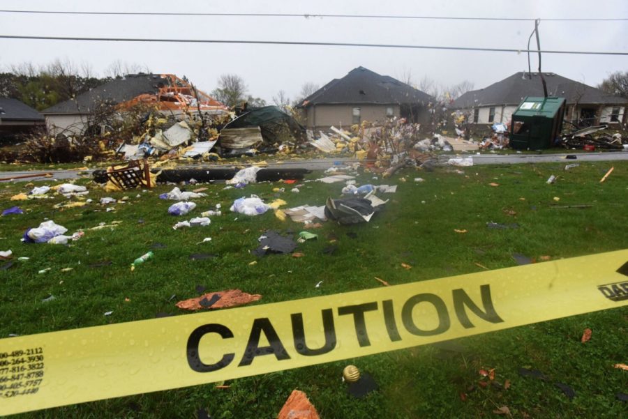 Debris+litters+a+neighborhood+one+block+west+of+Powell+Street+near+Don+Tyson+Parkway+Wednesday%2C+March+30%2C+2022+in+Springdale%2C+Ark.+Severe+storms+that+included+at+least+two+tornadoes+injured+several+people%2C+damaged+homes+and+businesses+and+downed+power+lines+in+Arkansas+and+Missouri+overnight+as+twisters+and+hurricane-force+winds+were+forecast+in+much+of+the+Deep+South+on+Wednesday.%28Flip+Putthoff%2FThe+Northwest+Arkansas+Democrat-Gazette+via+AP%29