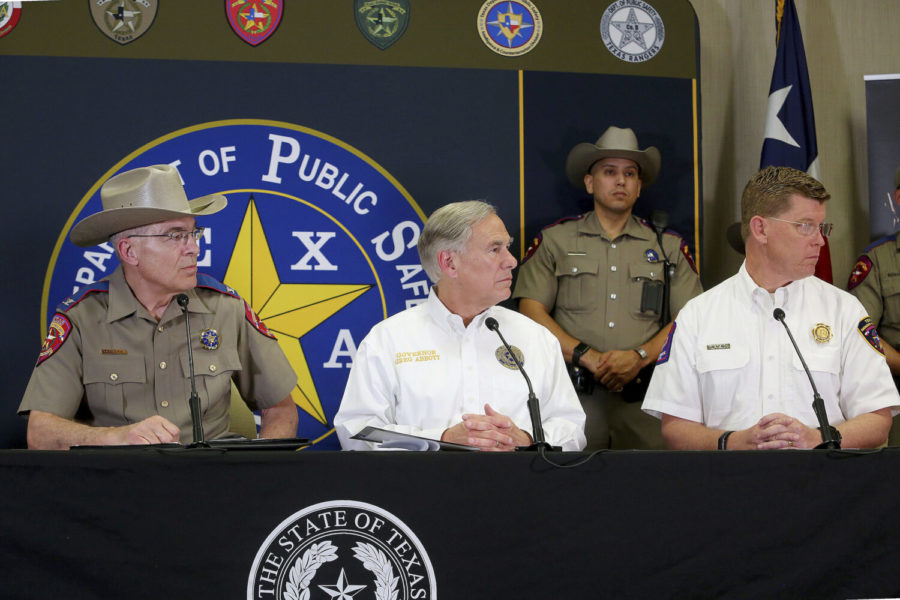 Left to right DPS Director Steve McCraw, Texas Governor Greg Abbott and Chef of the Texas Division of Emergency Management W. Nim Kidd, listen to a question a press conference at the Texas Department of Public Safety Weslaco Regional Office on Wednesday, April 6, 2022, in Weslaco, Texas. (AP Photo/ Joel Martinez)