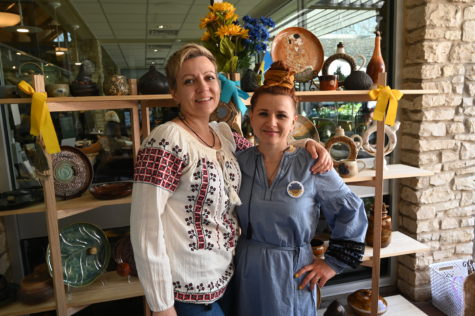 Ukrainian artists Vasfie Abdurafeeva and Anna Andriets stand in front of their work at a festival at the Fort Worth Botanic Garden. 