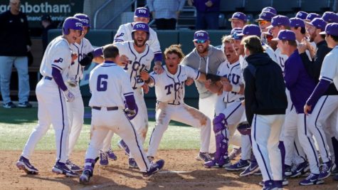 Right fielder Luke Boyers, after hitting a walk off home run, celebrates with his teammates at home plat on March 12, 2022. (Photo courtesy of GoFrogs.com)