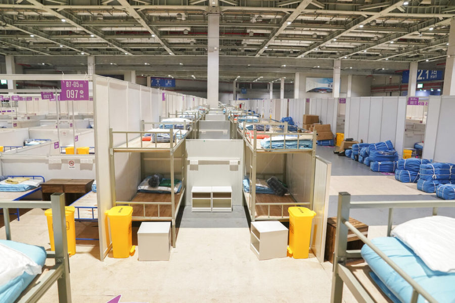 In this photo released by Xinhua News Agency, bunk beds are seen at a makeshift hospital and quarantine facility at the National Exhibition and Convention Center in Shanghai, Monday, April 11, 2022. The U.S. has ordered all non-emergency consular staff to leave Shanghai, which is under a tight lockdown to contain a COVID-19 surge. (Ding Ting/Xinhua via AP)