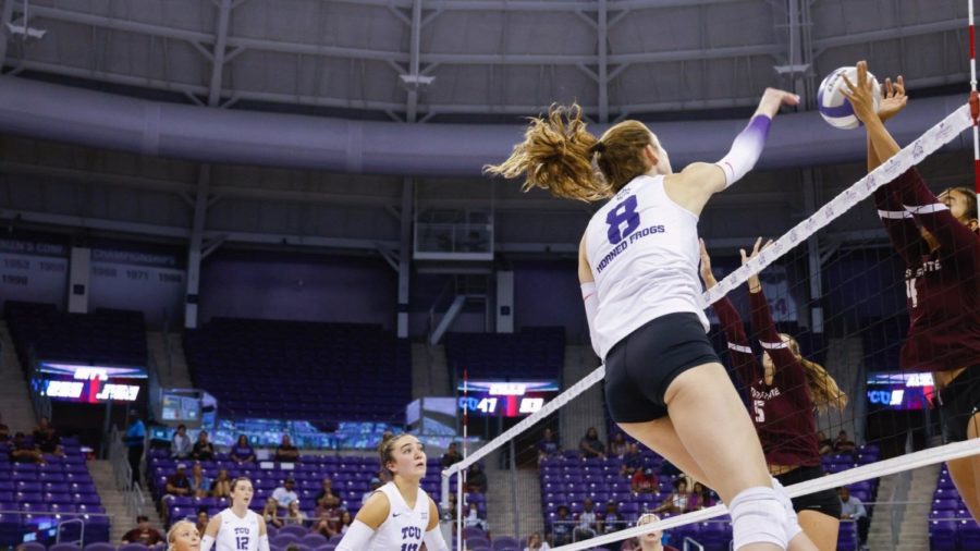 Middle+blocker+Madilyn+Cole+sends+a+ball+plummeting+towards+the+Texas+State+defense+on+Saturday+Sept.+17%2C+2022.+%28Photo+courtesy+of+GoFrogs.com%29
