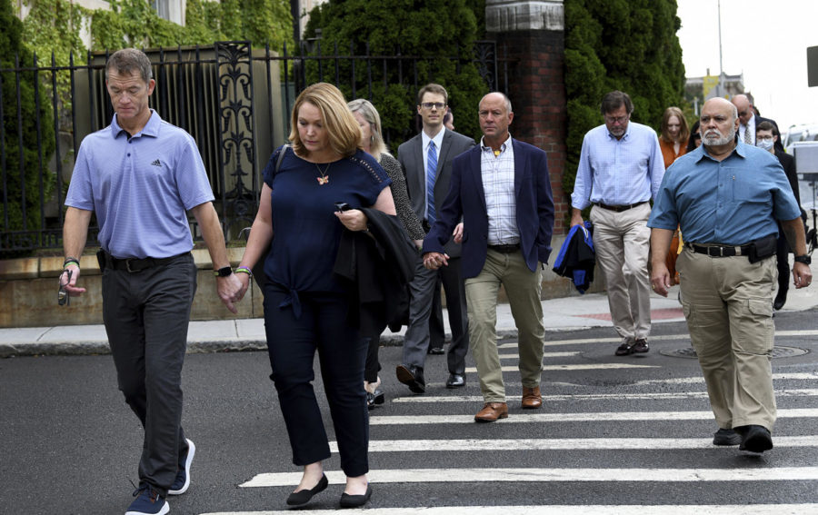 Sandy Hook families arrive together at Waterbury Superior Court Tuesday morning, Sept. 13, 2022, in Waterbury, Conn., for the start of conspiracy theorist Alex Jones trial. (Carol Kaliff/Hearst Connecticut Media via AP)