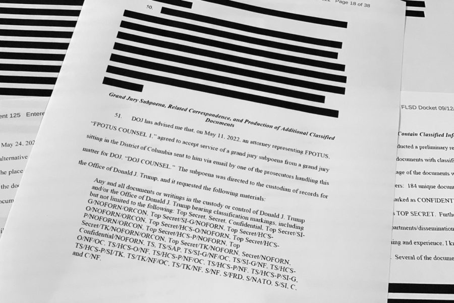 Pages from the FBI affidavit laying out the basis for a search warrant for former President Donald Trumps Mar-a-Lago estate, is photographed Tuesday, Sept. 13, 2022. (AP Photo/Jon Elswick)