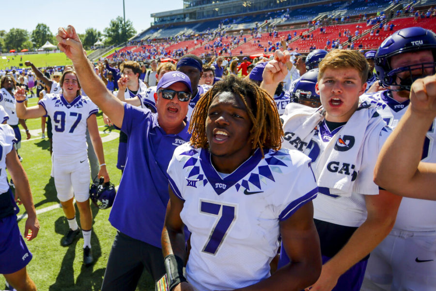 TCU head coach Sonny Dykes, left, celebrates with his players after a victory over SMU in an NCAA college game on Saturday, Sept. 24, 2022, in Dallas, Texas. (AP Photo/Gareth Patterson)