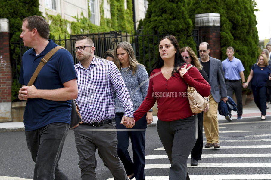 Sandy Hook families arrive together at Waterbury Superior Court, Tuesday morning, Sept. 13, 2022, in Waterbury, Conn., for the start of conspiracy theorist Alex Jones trial. (Carol Kaliff/Hearst Connecticut Media via AP)
