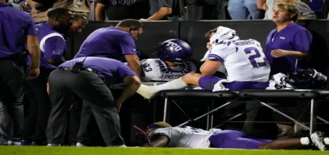 TCU quarterback Chandler Morris, right, is attended to by trainers after being injured while throwing a pass in the second half of an NCAA college football game against Colorado Friday, Sept. 2, 2022, in Boulder, Colo. (AP Photo/David Zalubowski)
