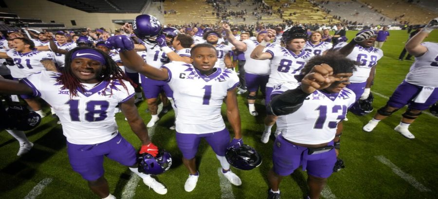 From left, TCU wide receivers Savion Williams and Quentin Johnston and linebacker Dee Winters sing the school song after the second half of an NCAA college football game against Colorado Friday, Sept. 2, 2022, in Boulder, Colorado. (AP Photo/David Zalubowski)