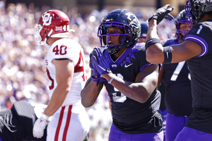 TCU running back Emari Demercado (3) celebrates with teammates after running for a touchdown against Oklahoma during the first half of an NCAA college football game Saturday, Oct. 1, 2022, in Fort Worth, Texas. (AP Photo/Ron Jenkins)