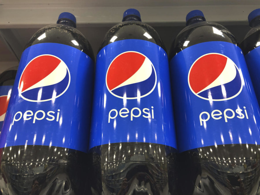 FILE+-+A+row+of+2+liter+Pepsi+Cola+line+a+shelf+at+a+Publix+Supermarket%2C+Monday%2C+Feb.+8%2C+2021+in+Miami.++PepsiCo+raised+its+full-year+revenue+and+earnings+forecast+Wednesday%2C+Oct.+12%2C+2022%2C++after+a+stronger-than-expected+third+quarter+sales+driven+by+higher+prices.+The+Purchase%2C+New+York-based+snack+and+drink+maker+said+its+sales+volumes+were+down+1%25+from+the+July-September+period+a+year+ago.+But+pricing+surged+17%25.+PepsiCo+said+its+trying+to+recoup+higher+price+increases+for+raw+ingredients+as+transportation+and+marketing.++%28AP+Photo%2FMarta+Lavandier%2C+File%29