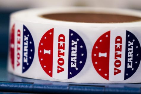 Early voting stickers are seen at a polling station Tuesday, Oct. 25, 2022, in Milwaukee. Tuesday marks the first day to vote early in Wisconsin. (AP Photo/Morry Gash)