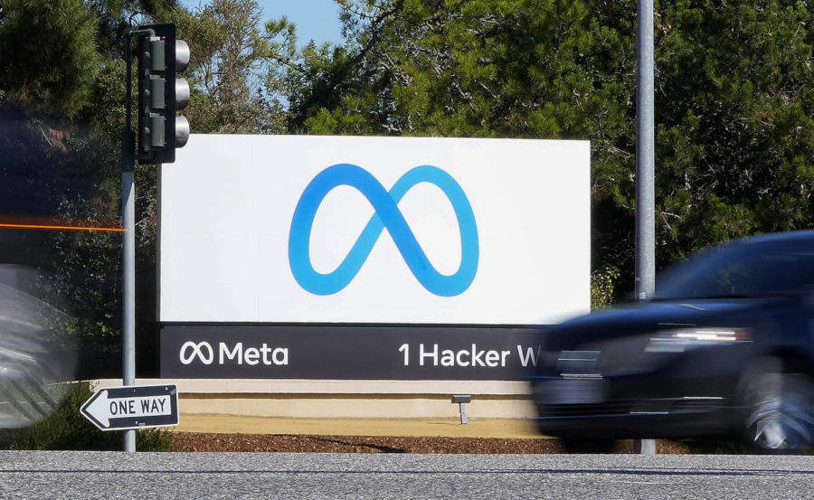 FILE - A car passes Facebooks new Meta logo on a sign at the company headquarters on Oct. 28, 2021, in Menlo Park, Calif. Facebook parent Meta on Wednesday, Oct. 26, 2022, reported that its revenue declined for a second consecutive quarter, hurt by falling advertising revenue amid competition from the wildly popular video app TikTok. (AP Photo/Tony Avelar, File)