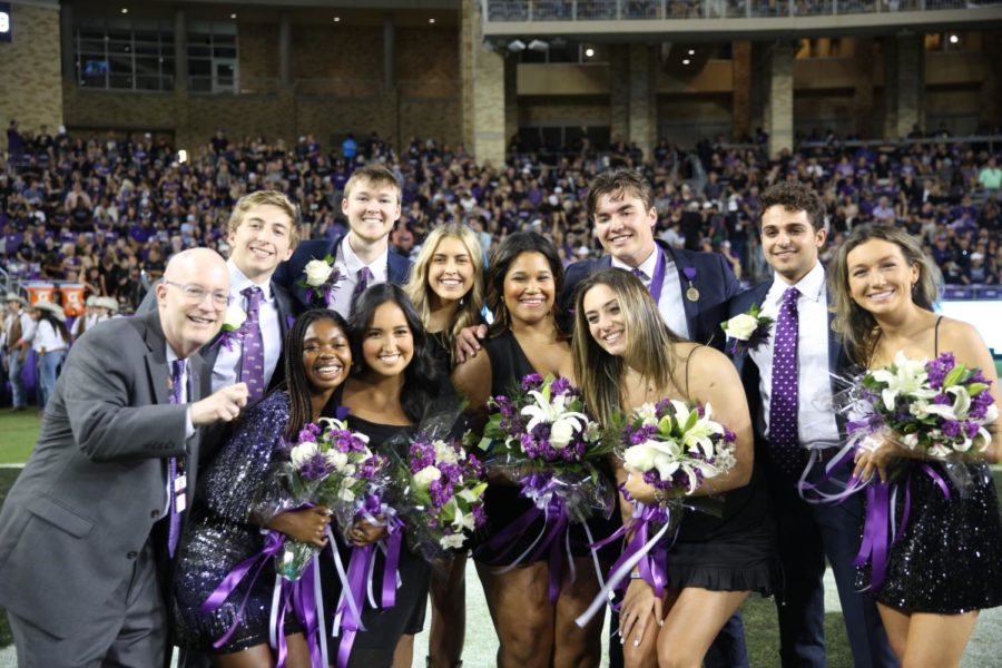 TCUs 2022 outstanding seniors take a picture with Chancellor Boschini at halftime of a football game Oct. 22, 2022.