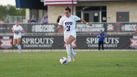 Forward AJ Hennessey controls the ball against Kansas on Oct. 30, 2022. (photo courtesy of GoFrogs.com)