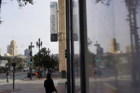 A sign for Twitter headquarters is reflected in. a window in San Francisco, Friday, Nov. 4, 2022. Employees were bracing for widespread layoffs at Twitter on Friday, as new owner Elon Musk overhauls the social platform. (AP Photo/Jeff Chiu)