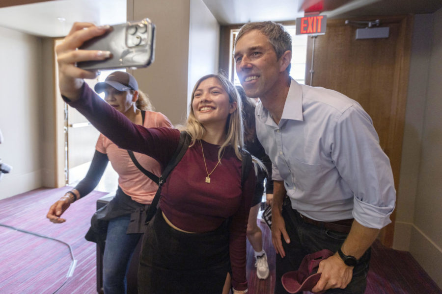 A Texas A&M students takes a selfie with Beto ORourke, Texas Democratic gubernatorial candidate, during a campaign stop at Texas A&M, Monday, Nov. 7, 2022, in College Station, Texas. (Logan Hannigan-Downs/College Station Eagle via AP)
