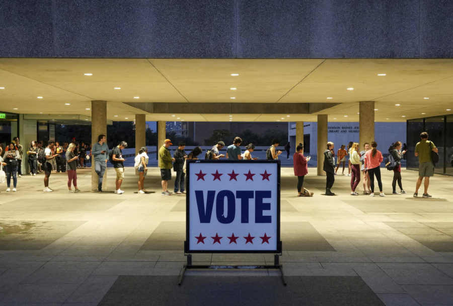 Voters wait in line at a polling place at the Lyndon B. Johnson School of Public Affairs in Austin, Texas, on election night, Tuesday, Nov. 8, 2022. (Jay Janner/Austin American-Statesman via AP)